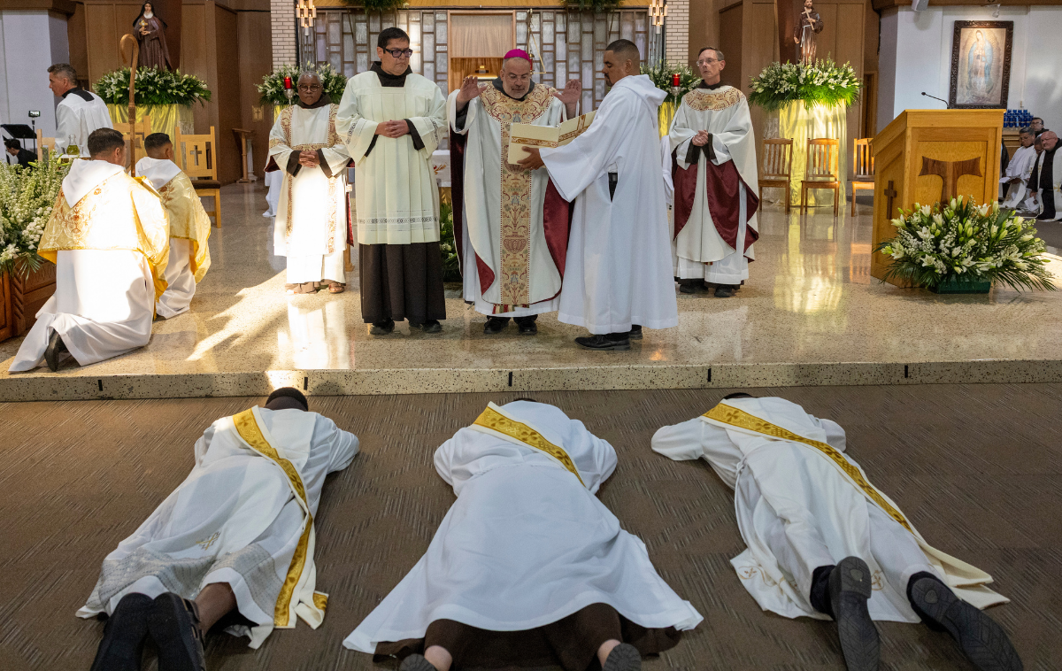Candidates for ordination lay prostrate in the nave. This posture is a poignant sign that emphasizes their dependence on God and others’ prayers. It is a self-emptying gesture that symbolizes a surrender of oneself to the church in religious life. (Photo courtesy of Br. Octavio Duran, OFM)  