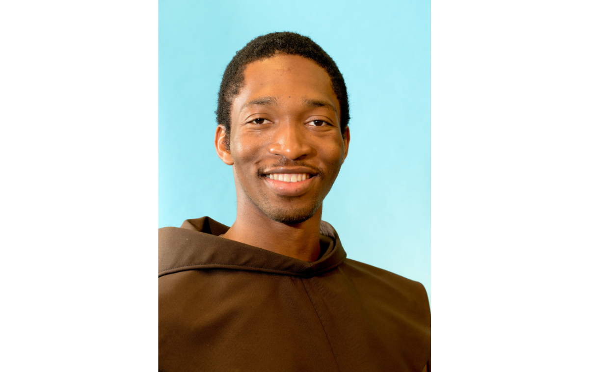 A smiling man wearing a friar habit