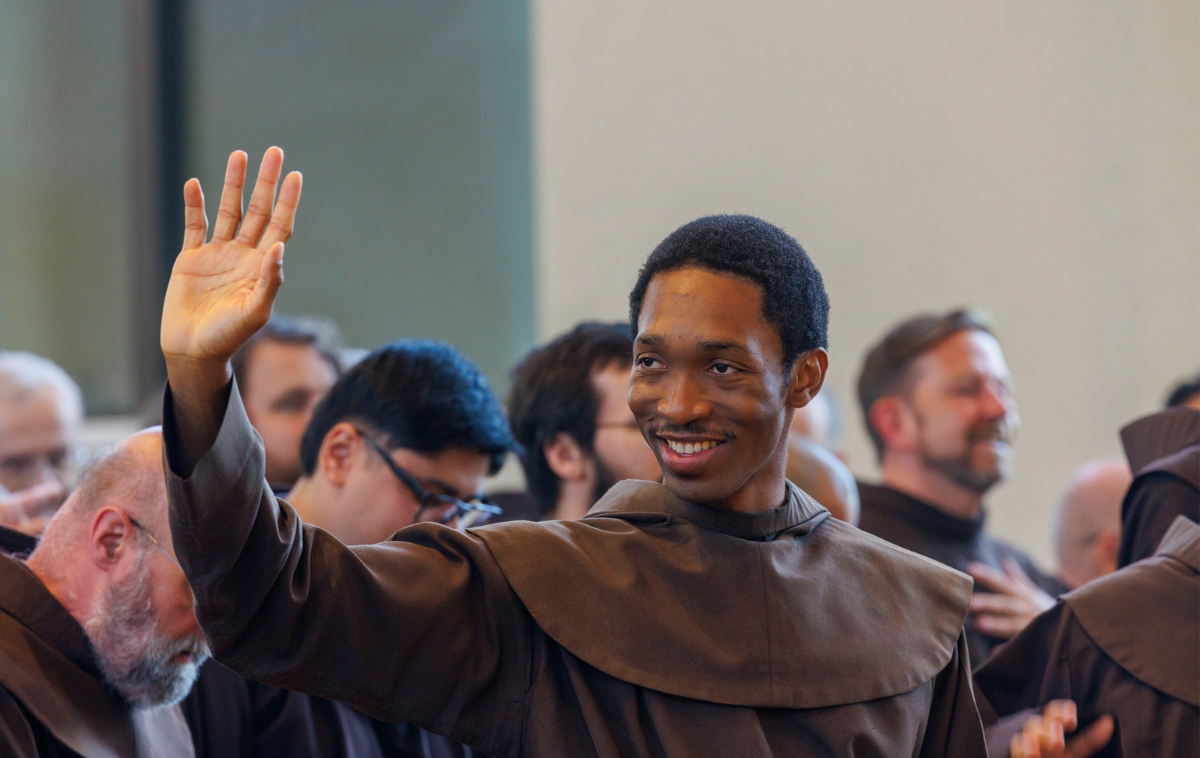 The four friars lie face down in the aisle of the church.