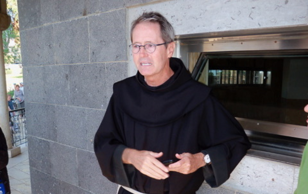 Br. Bill Burton, OFM, chats with pilgrims at the Church of the Beatitudes in Galilee. Pilgrimages are an integral part of learning, he believes. (Photo courtesy of Br. Bill)