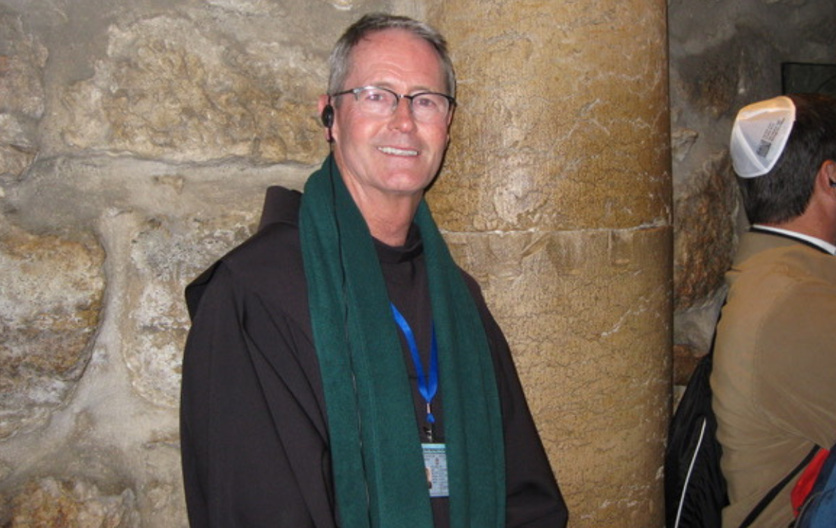 Br. Bill Burton, OFM, with pilgrims in the Church of the Holy Sepulchre in Jerusalem. His shared journeys with people of different faiths have deepened his understanding of a benevolent God and his incredible creation. (Photo courtesy of Br. Bill)