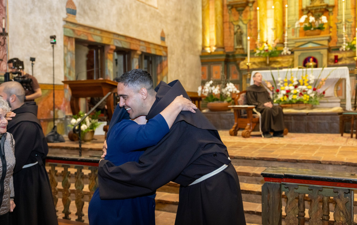 Br. Jesus Heber Lara Romero, OFM, joyfully accepts an embrace after professing his simple vows. (Photo by Br. Octavio Duran, OFM)