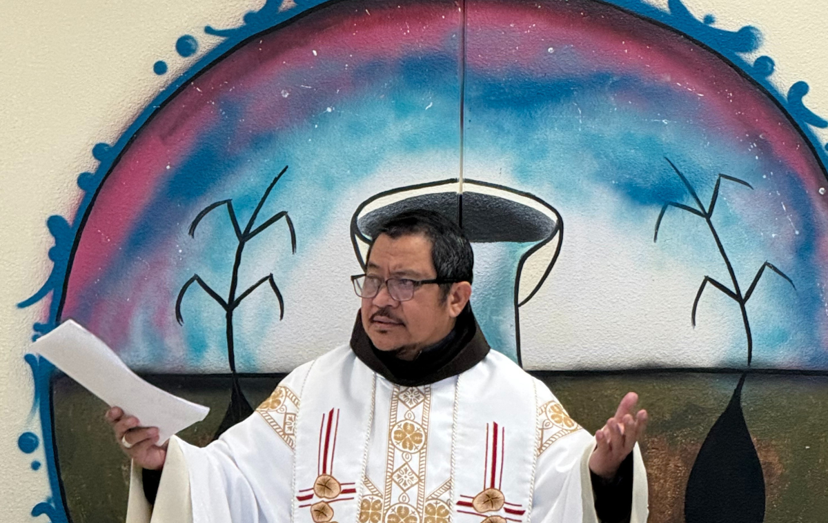 Br. PJ stands in front of the altar of Our Lady of Fatima Church.