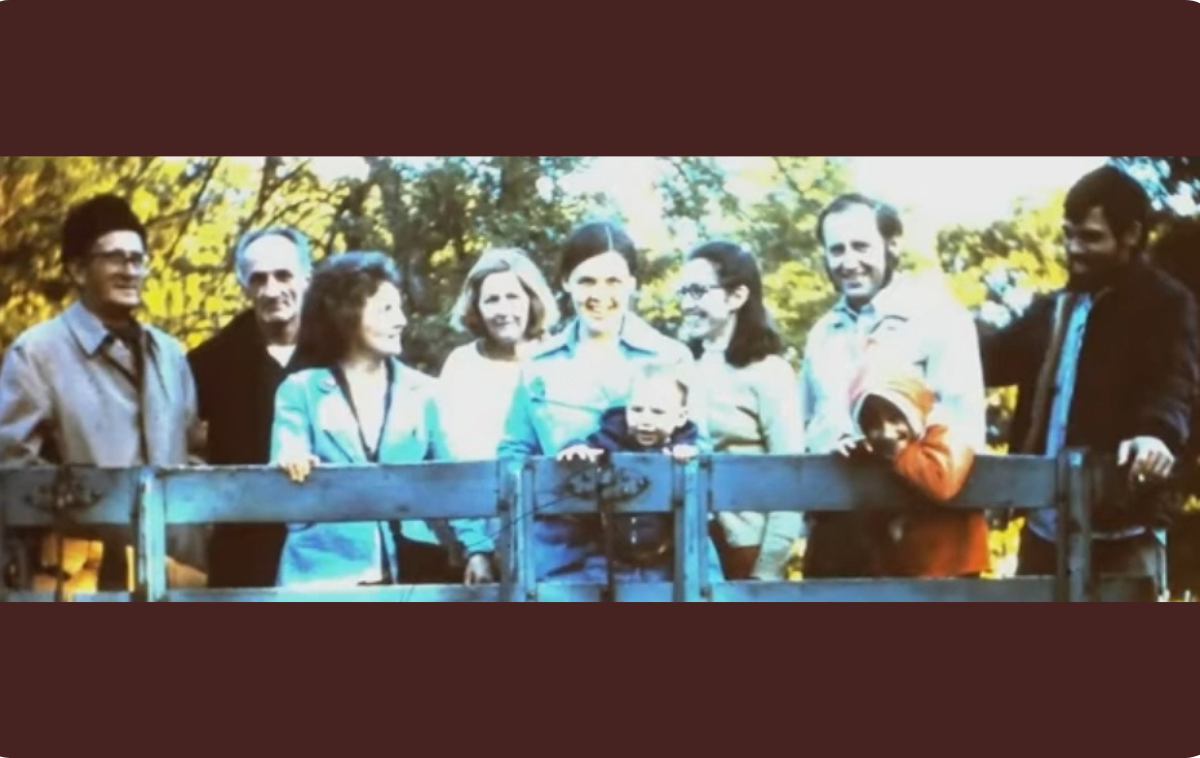 Members of the Gospel Family community pose for a photo in the back of a trailer on the grounds of a Catholic retreat house run by Franciscan sisters. The group grew crops and sold them in town. In a Zoom call with several group members, one member recalled that they accidentally planted cherry tomatoes instead of classic globe tomatoes. (Photo courtesy of Br. David)