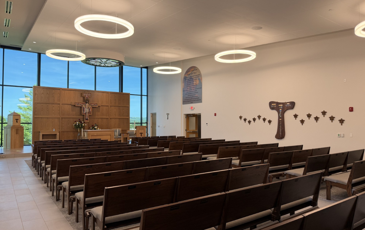 A Tau cross - adopted by St. Francis as his signature symbol expressing penance and a life to devoted to peace, simplicity and service to God - serves as reliquary that contains relics from 82 saints. (Photo courtesy of Roger Bacon High School)
