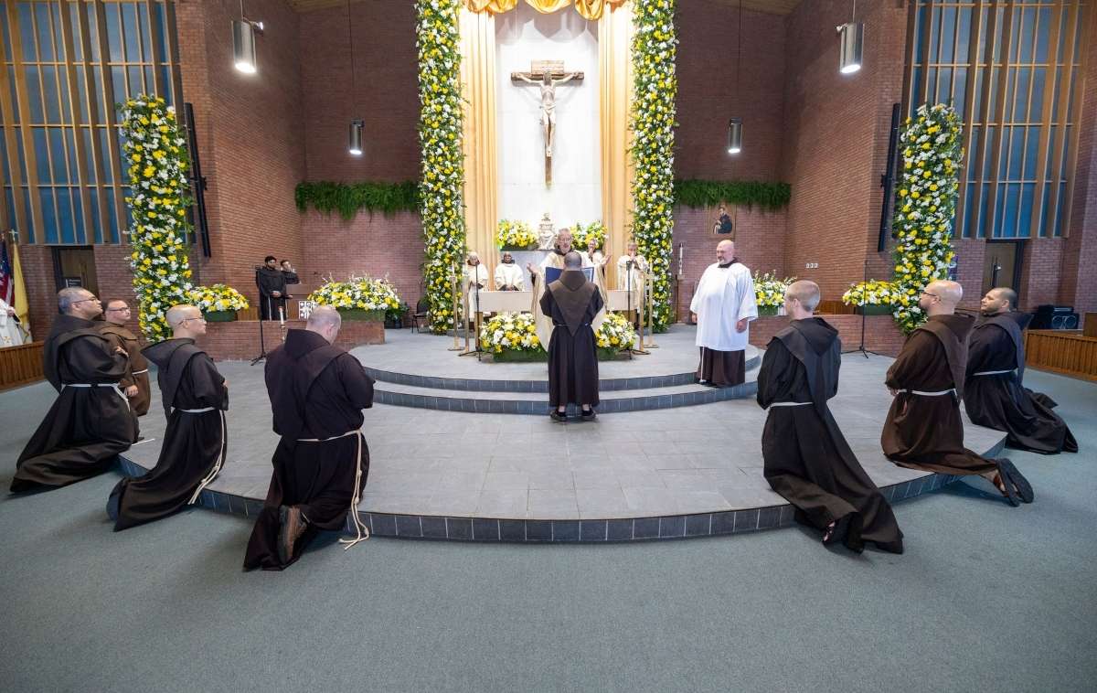 The candidates kneel for the Prayer of Consecration. (Photo courtesy of Br. Octavio Duran, OFM)