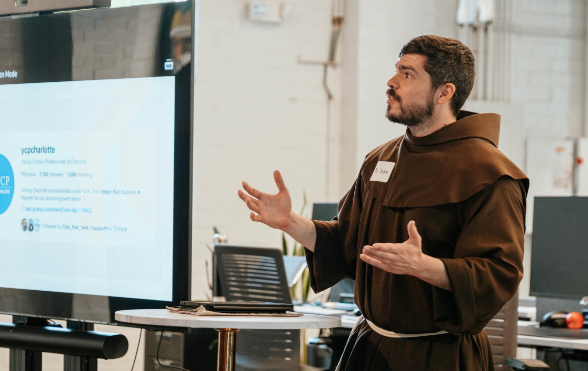 Br. Jason Damon, OFM, leads a discussion on artificial intelligence through a Catholic and Franciscan lens. His approach is informed by the realities facing many young adults today. "People are leaving home for the first time. They're meeting their spouses. They're getting married. They're discovering a career," he said. "They're doing things that set the foundation for who they're going to be and who they want to be. It's crucial that the Church be able to accompany people at that time. I've learned that many young adults are not only open to that, but they're also eager for that." (Photo by Jessica Matthew)