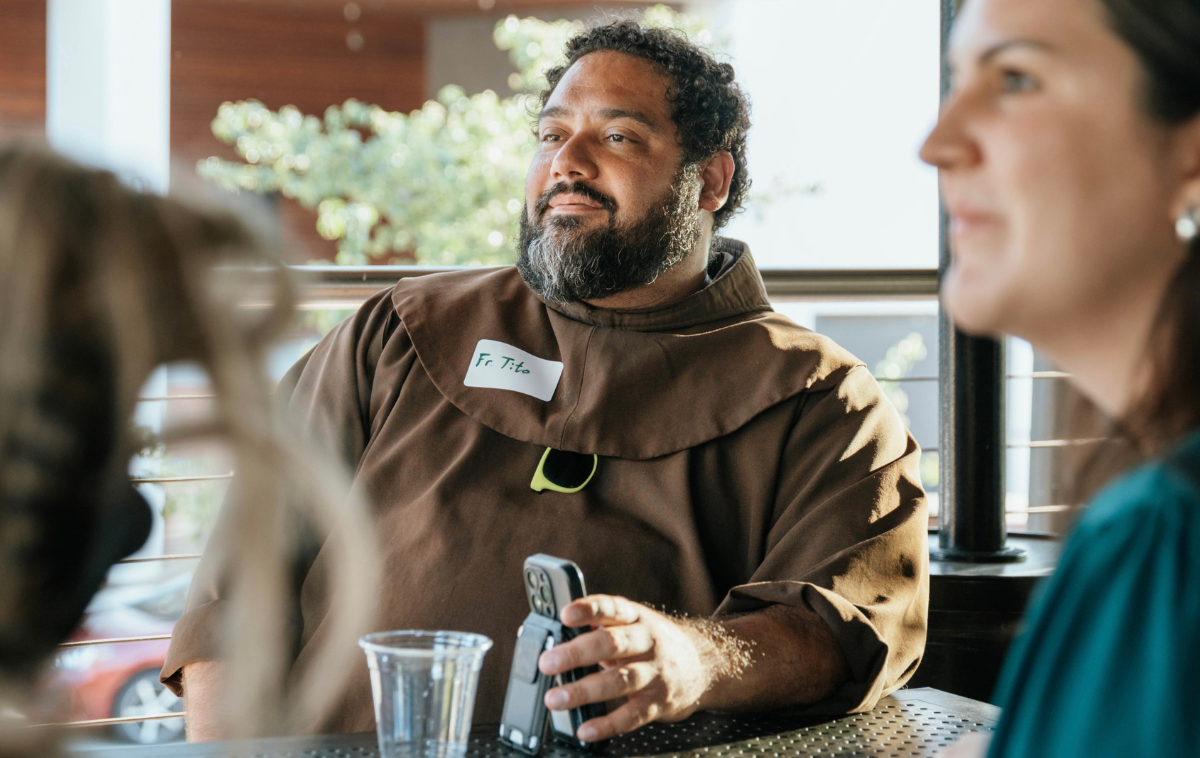 Br. Tito Serrano, OFM, listens to a discussion at the friars' weekly event. He said the Charlotte contingent is still learning, one year in. "There are things that we haven't thought of yet, things that we haven't tried yet. I really anticipate this potentially being an excellent example of ways in which to engage young adults," he said. "Hopefully other people, other friars, other religious, other priests in different dioceses are willing to try something like this." (Photo by Jessica Matthew)