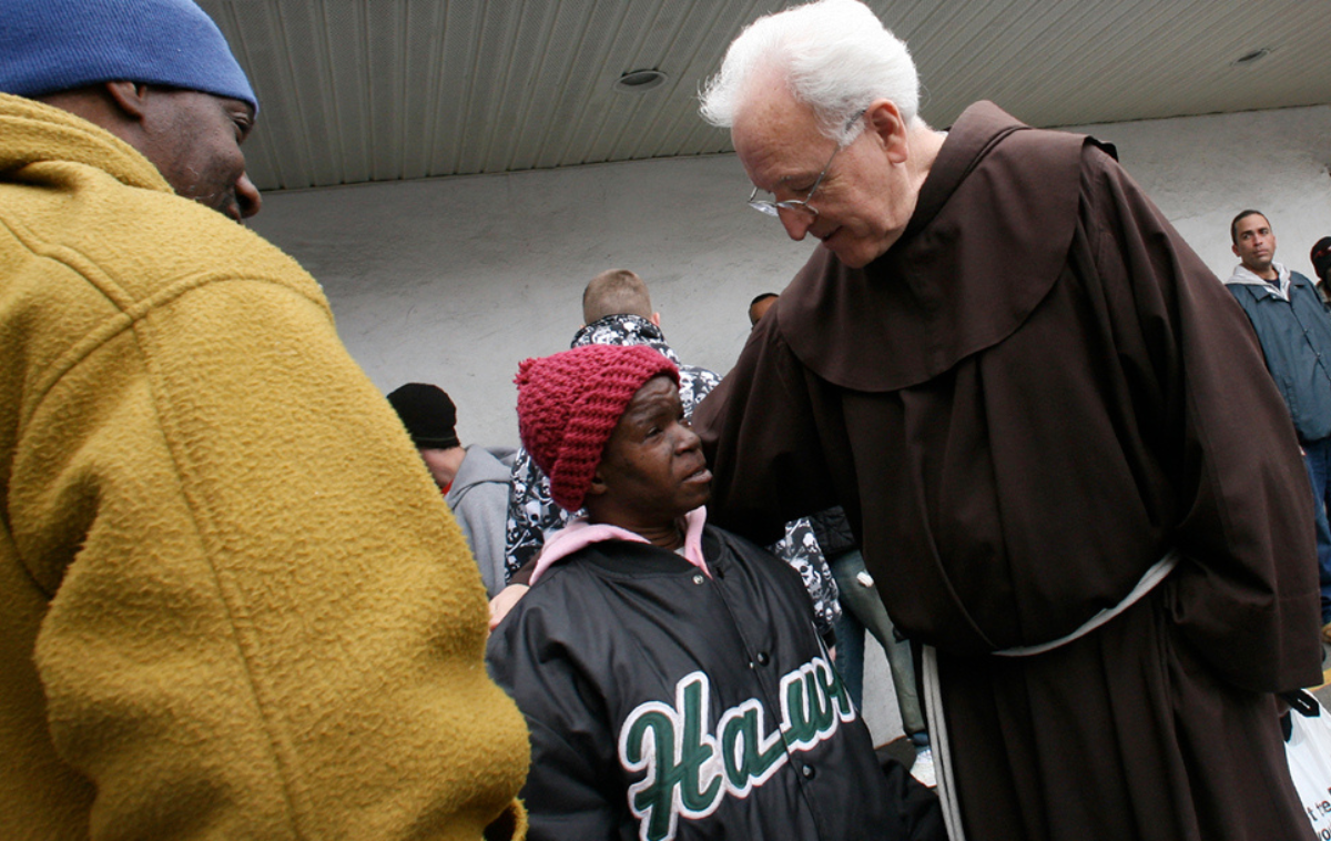 Br. Michael Duffy, OFM, stands with a guest outside St. Francis Inn in 
Philadelphia&rsquo;s Kensington Avenue neighborhood. Guests come to the inn 
not because food is costly, but because they cannot afford it at all. 
(Province of Our Lady of Guadalupe file photo)