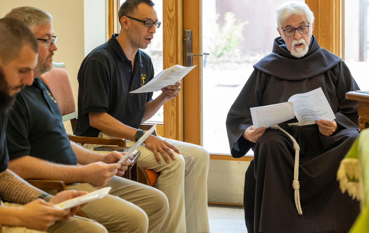 Br. Gino Correa, OFM, far right, reads at a postulant welcome ceremony at San Juan Diego Friary in Albuquerque in 2025. “What we all share in our coming and going is the trust we are asked to place in the One who asks us to begin again,” he said. 