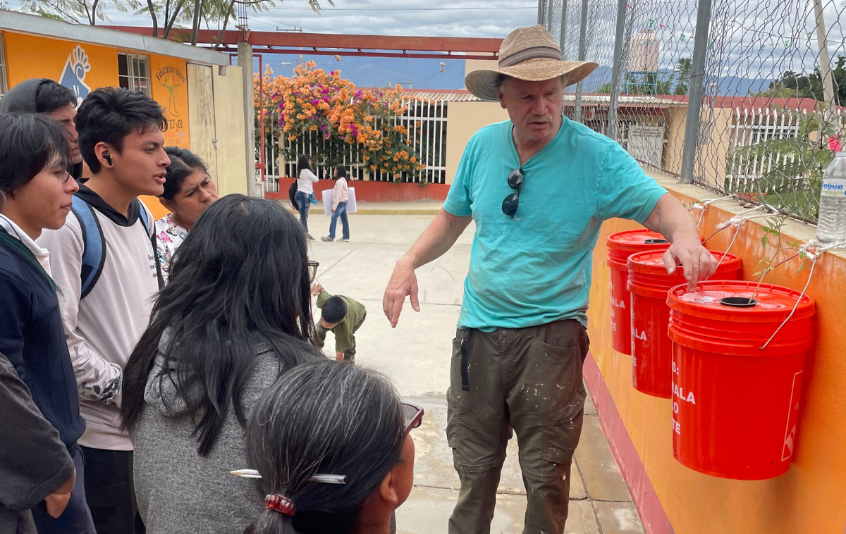 Br. Mike Johnson, OFM, teaches students in Oaxaca, Mexico, about Levo International’s bucket style of growing produce. (photo courtesy of Levo International)